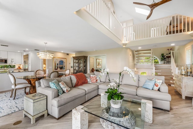 22 Seawatch Dr, Boca Grande, FL 33921 - living room featuring light wood finished floors, a ceiling fan, stairway, and recessed lighting