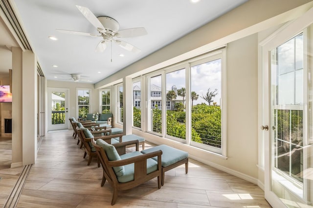 sunroom with ceiling fan