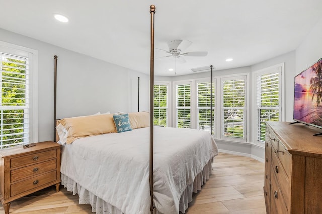 bedroom with light hardwood / wood-style floors and ceiling fan