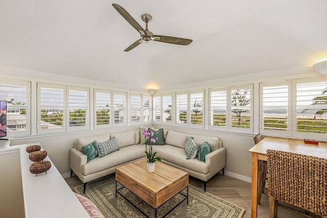 sunroom / solarium with ceiling fan and a healthy amount of sunlight