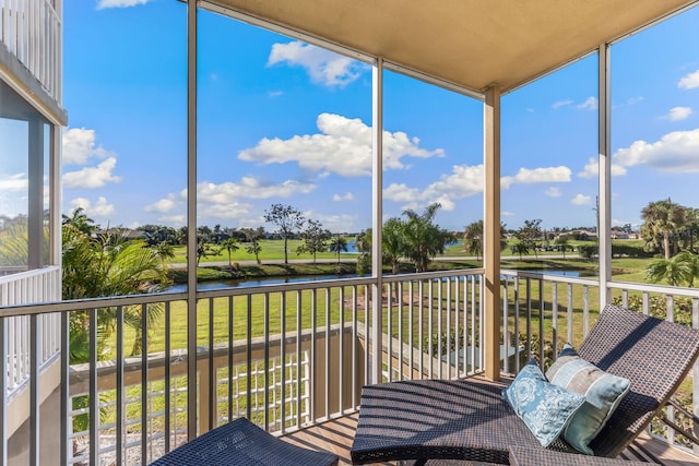 unfurnished sunroom featuring a healthy amount of sunlight and a water view