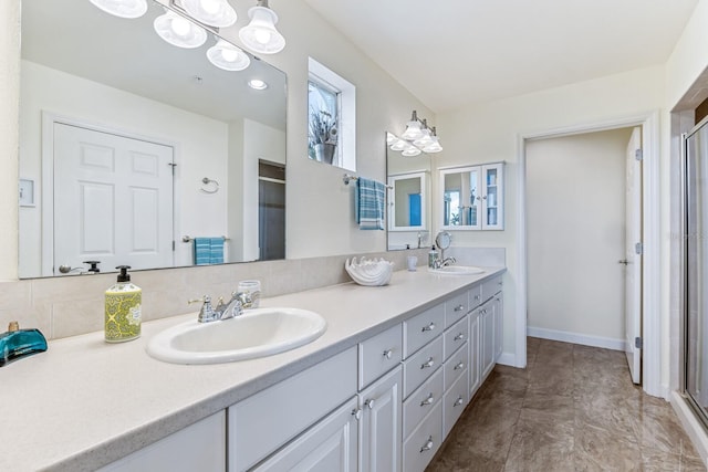 bathroom with decorative backsplash, walk in shower, and vanity