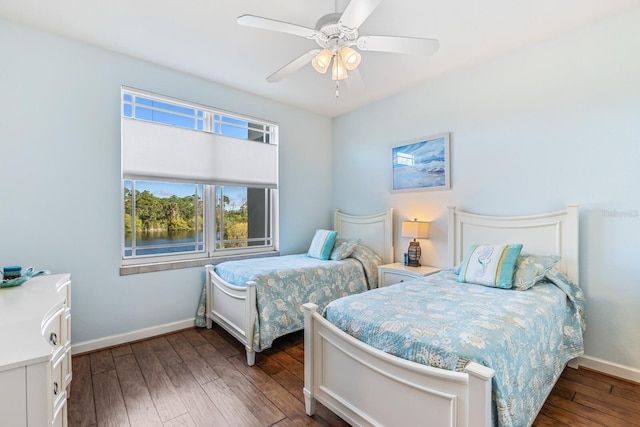 bedroom featuring dark hardwood / wood-style flooring and ceiling fan