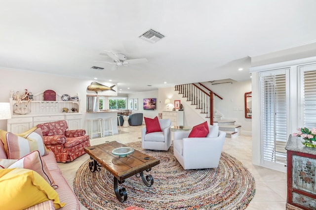 living room featuring ceiling fan and light tile patterned floors