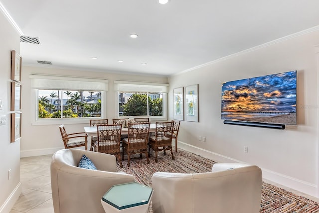 dining area with crown molding and light tile patterned floors