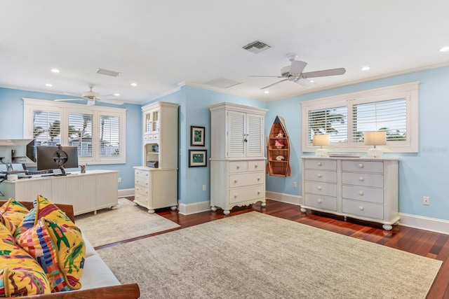 bedroom with hardwood / wood-style floors, multiple windows, and ceiling fan