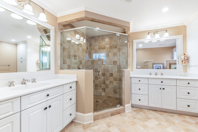 bathroom featuring vanity, ornamental molding, and walk in shower