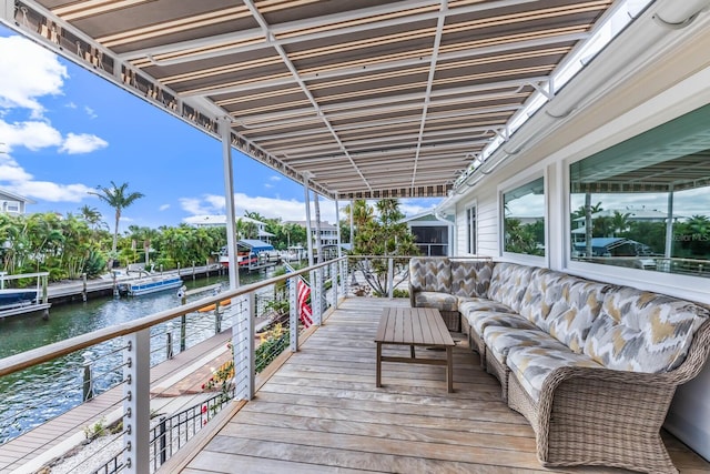 exterior space featuring an outdoor living space and a water view