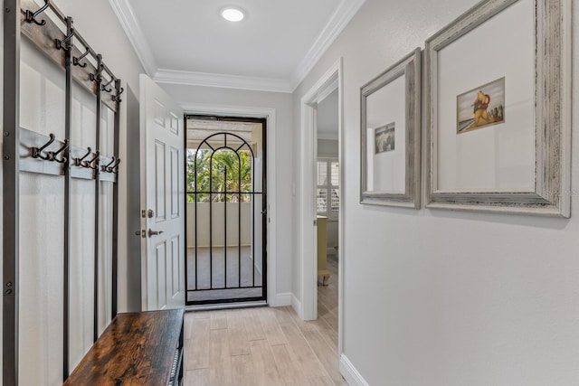 doorway to outside with ornamental molding