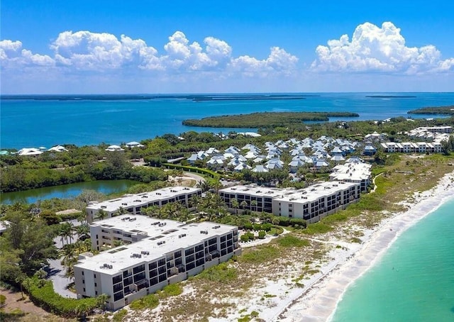 birds eye view of property featuring a view of the beach and a water view