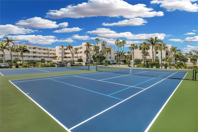 view of sport court with basketball hoop