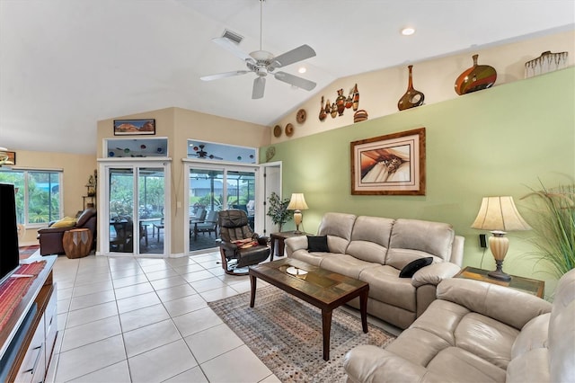 tiled living room featuring ceiling fan and high vaulted ceiling