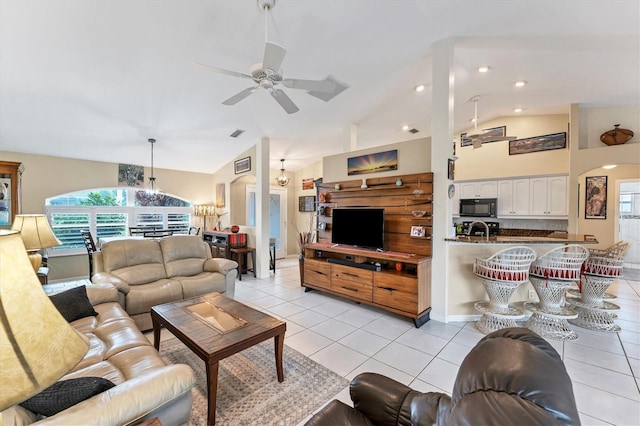 living room featuring light tile patterned flooring, high vaulted ceiling, and ceiling fan