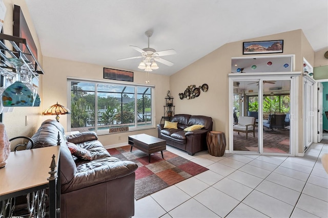 living room with vaulted ceiling, light tile patterned floors, and ceiling fan