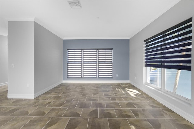 empty room featuring crown molding