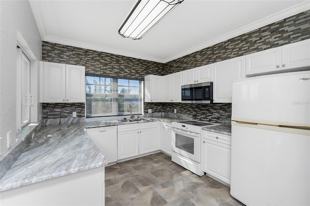 kitchen featuring sink, tasteful backsplash, crown molding, white appliances, and white cabinets