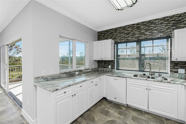 kitchen with dishwasher, decorative backsplash, white cabinetry, and sink