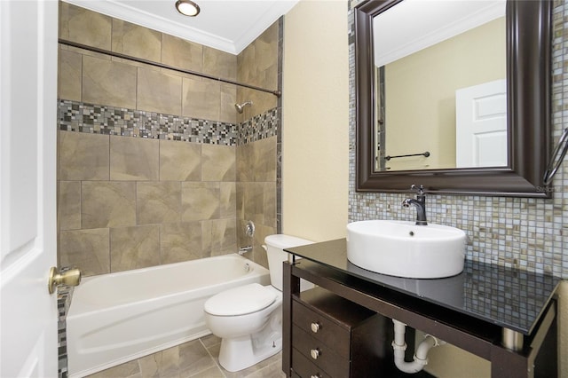 full bathroom with backsplash, tile patterned floors, tiled shower / bath combo, crown molding, and toilet