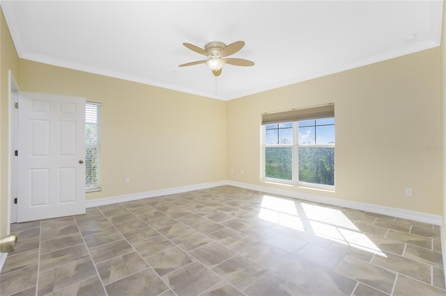 spare room featuring plenty of natural light, ceiling fan, and crown molding