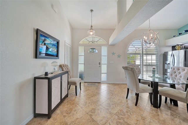 entryway featuring an inviting chandelier