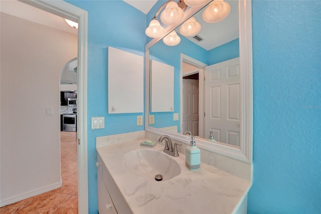 bathroom featuring vanity and tile patterned flooring