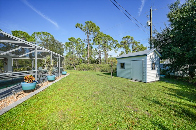 view of yard featuring a storage shed and a lanai