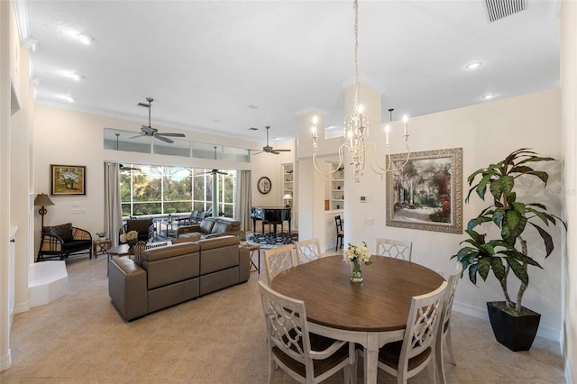 tiled dining room featuring ornamental molding and a chandelier