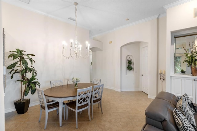 tiled dining space with crown molding and a chandelier