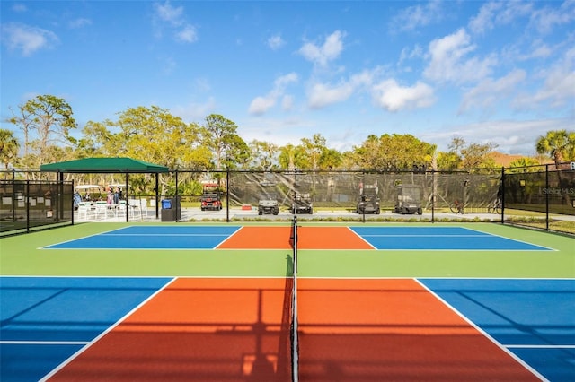 view of sport court with a gazebo and basketball hoop