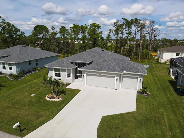 view of front of house with a garage and a front lawn