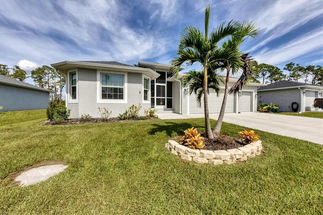 ranch-style home with a garage and a front lawn