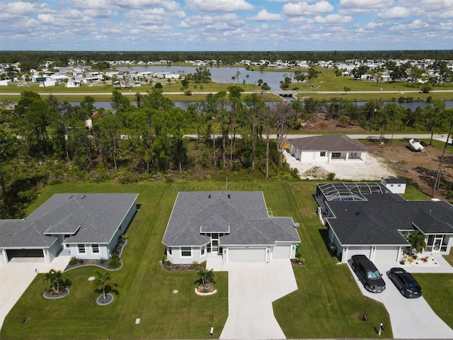 birds eye view of property with a water view