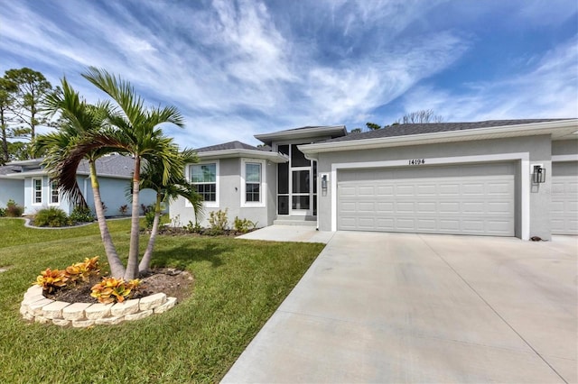 single story home featuring a garage and a front lawn