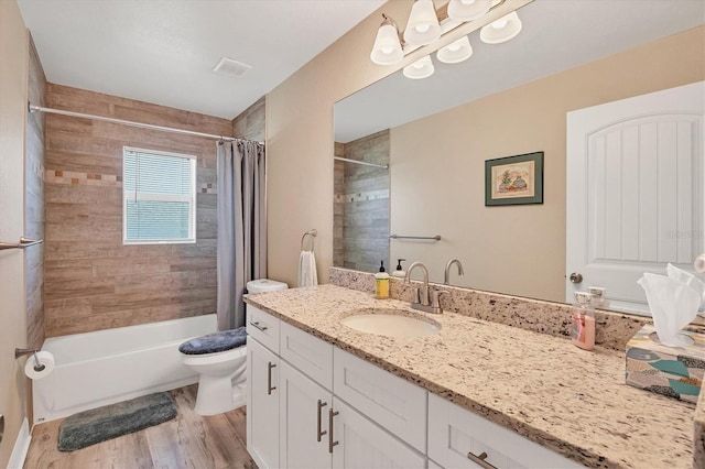 full bathroom featuring toilet, shower / tub combo with curtain, vanity, and hardwood / wood-style flooring