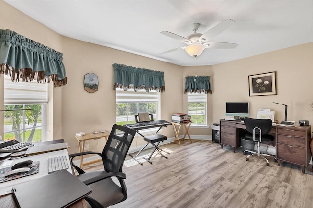 office area with light hardwood / wood-style floors and ceiling fan