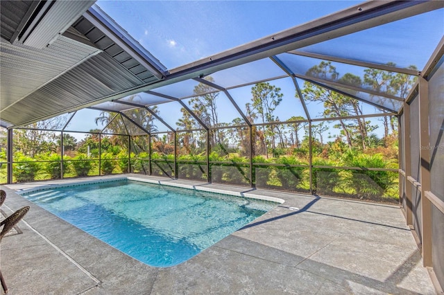 view of pool featuring a patio area and a lanai