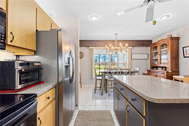 kitchen with a center island, decorative light fixtures, light tile patterned floors, black appliances, and ceiling fan with notable chandelier