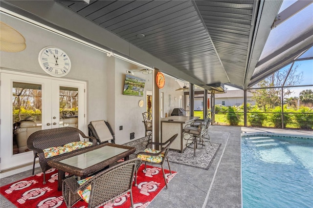 view of patio with a lanai and french doors