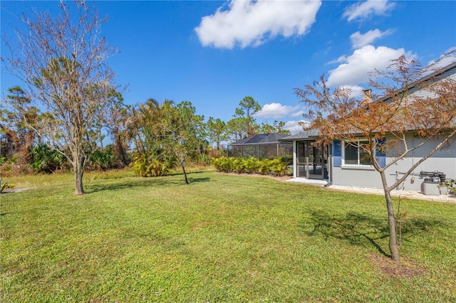 view of yard with a lanai