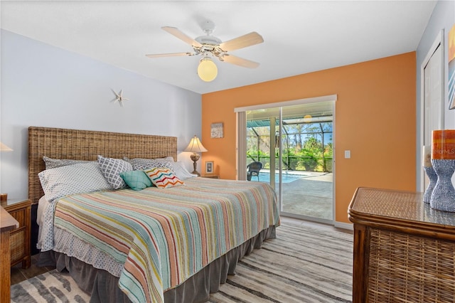 bedroom with ceiling fan, access to outside, and baseboards