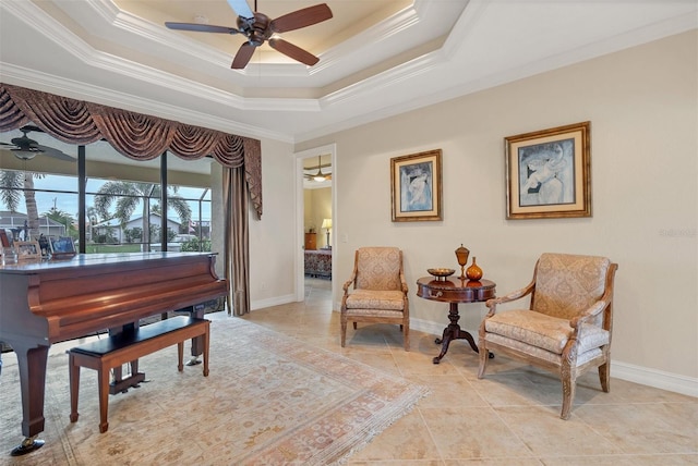 living area with a raised ceiling, ornamental molding, and light tile patterned flooring