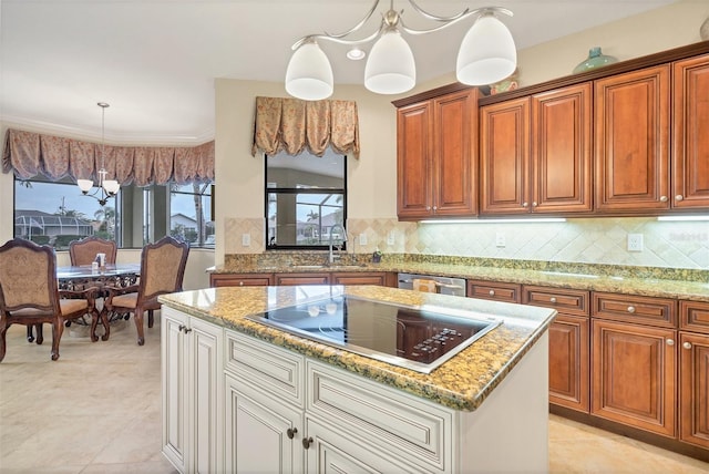 kitchen with an inviting chandelier, pendant lighting, sink, stainless steel dishwasher, and black electric stovetop