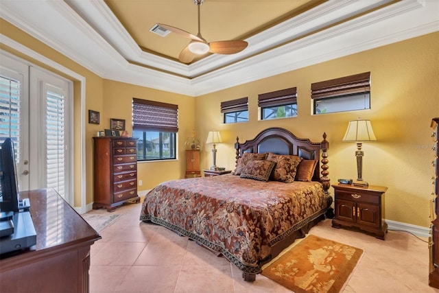 bedroom featuring ornamental molding, ceiling fan, light tile patterned floors, and a raised ceiling