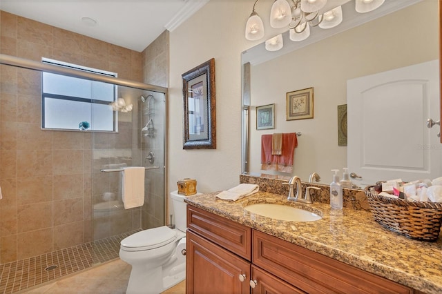 bathroom featuring tile patterned flooring, toilet, crown molding, an enclosed shower, and vanity