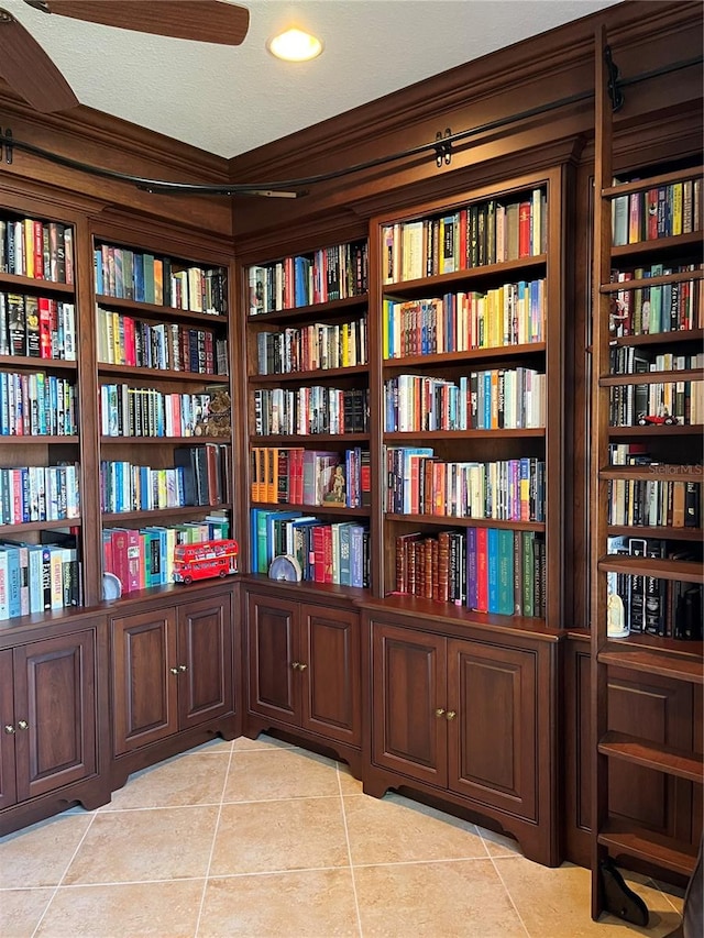 interior space with light tile patterned flooring and a textured ceiling