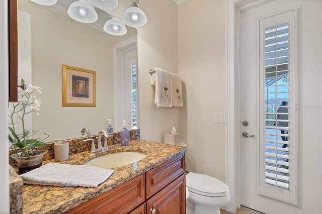 bathroom with vanity and toilet