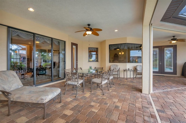 view of patio with ceiling fan and french doors