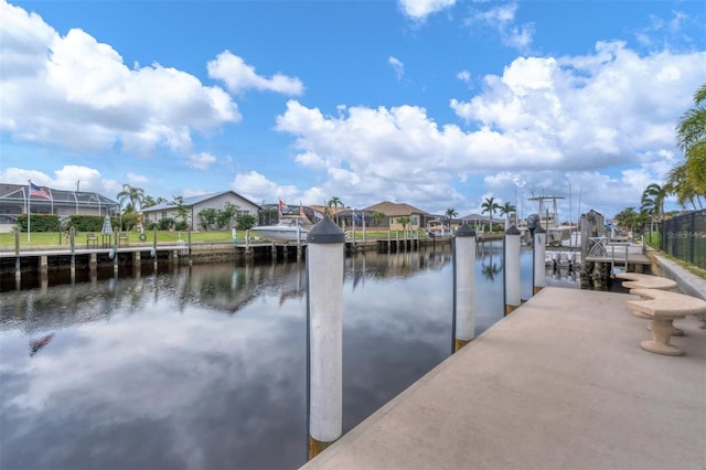 dock area featuring glass enclosure and a water view