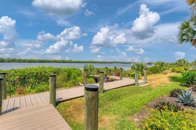 exterior space with a water view and a yard