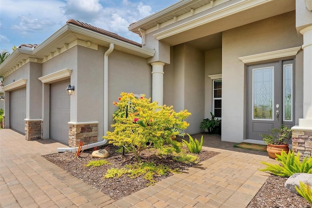 property entrance with a garage